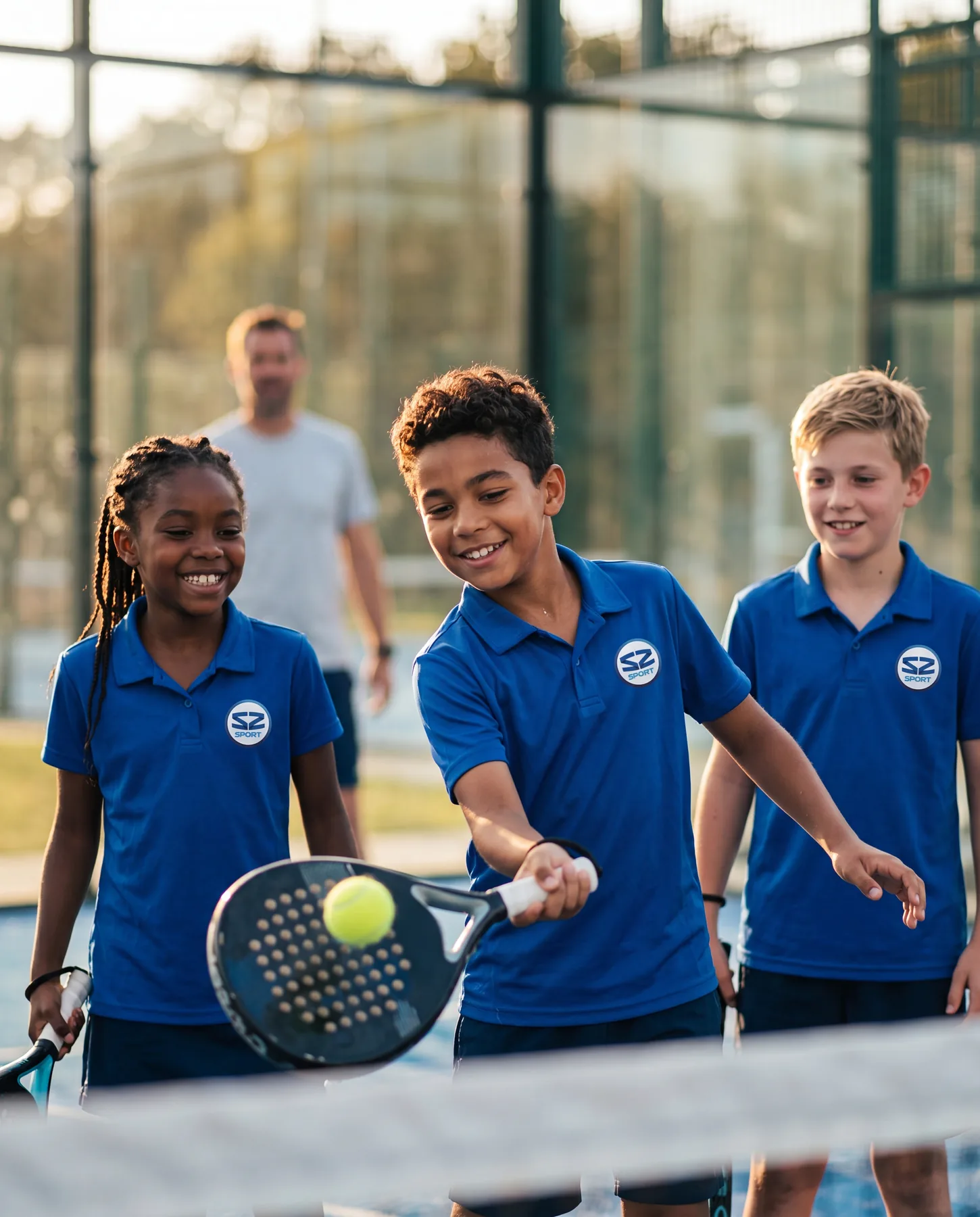 Kids in S2 kit with padel rackets