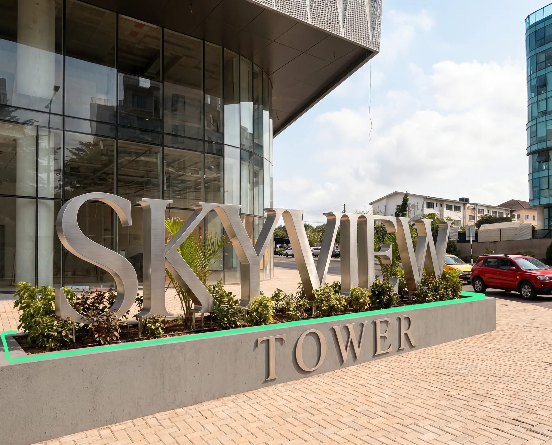 Brushed steel letters set into the entrance planter